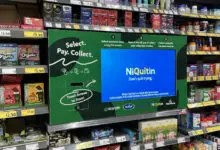 Items are selected on a shelf-mounted kiosk and retrieved from a dispenser at the store’s exit. (Photo: Strongpoint)