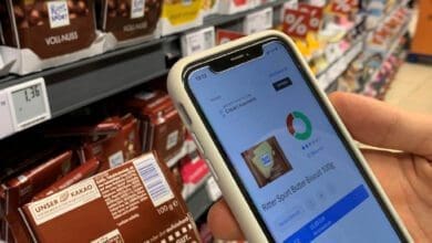 Shopper scans a bar of chocolate in Egelsbach's Rewe-Center (Germany) with the Codecheck application. (Photo: Retail Optimiser)