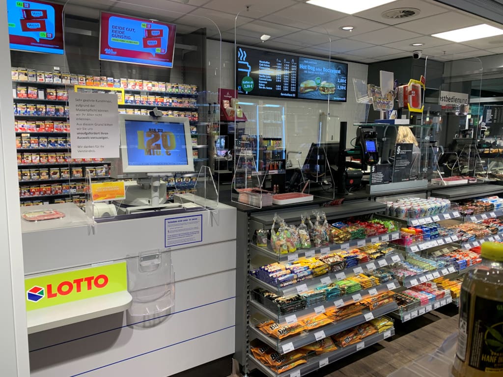 Sales staff taking lottery tickets from customers during the working hours of the day. (Photo: Retail Optimiser)