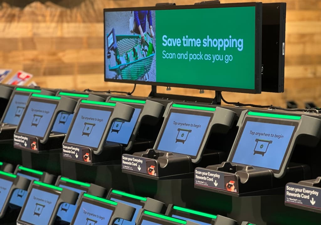 Customers unlock the detachable tablet devices by scanning their Woolworths’ promotional card. The tablet computer can then be attached to the trolley. (Photo: Hanshow)