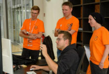 Obi CIO Tim Engler (left) with top management colleagues selecting the best results from an internal hackathon in October 2024. (Photo: Obi)